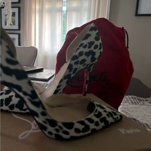 Christian louboutin , black and white heels